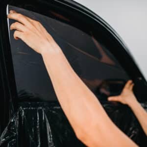 specialist work with car tinting film installing 2024 12 02 21 22 50 utc scaled